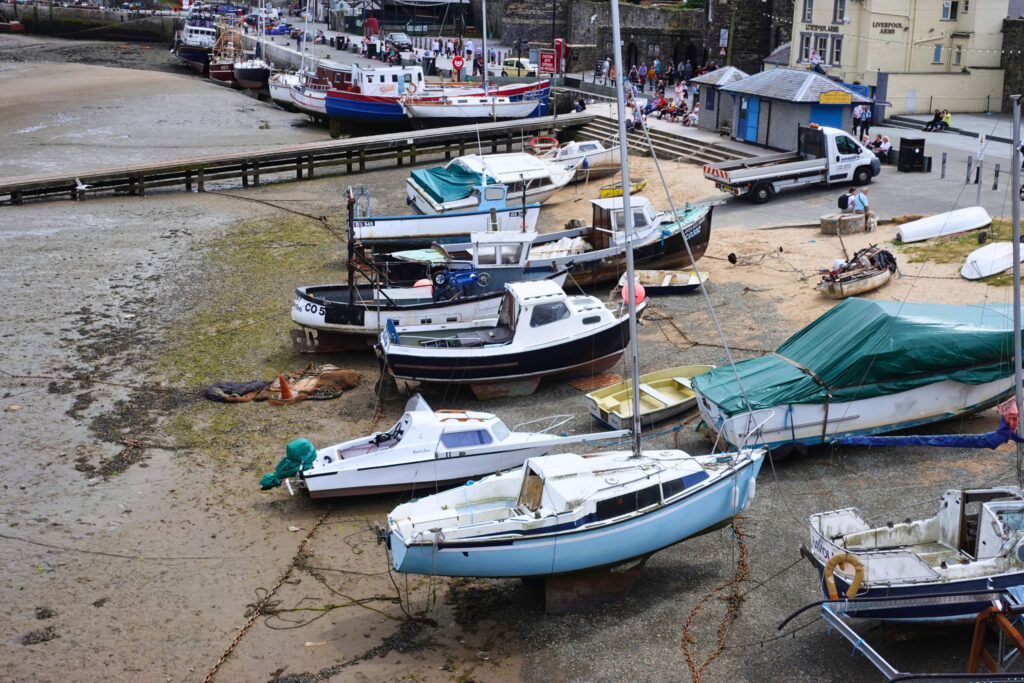 Boats at low tide on the shore of Conway